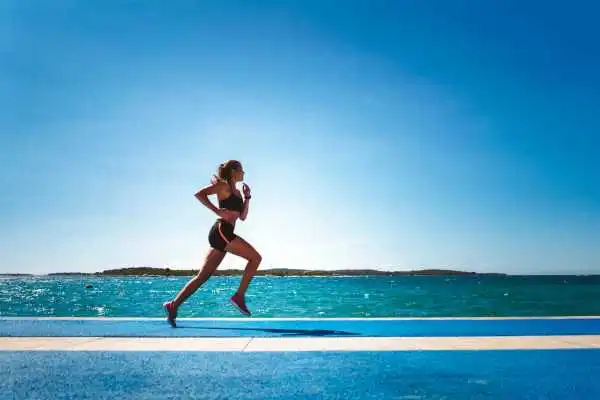 Woman running showing strong leg muscle High Wycombe